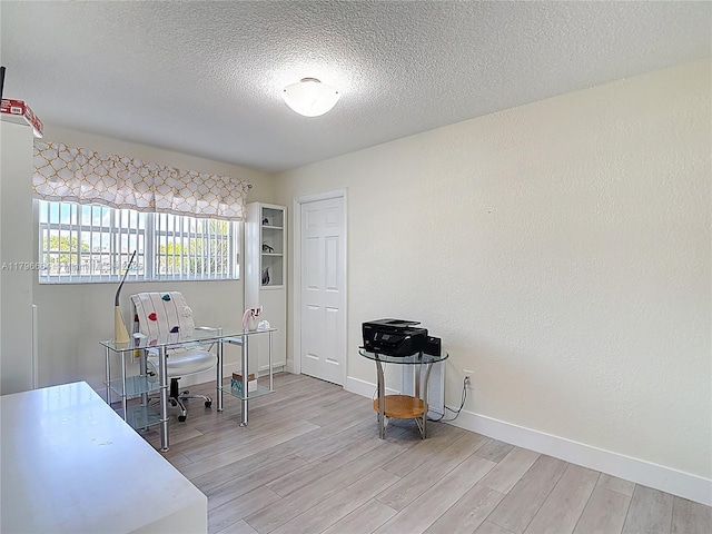 17931 NW 85th Ave, Hialeah, FL 33015 - office area featuring light wood-type flooring and a textured ceiling