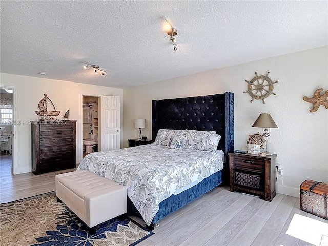 17931 NW 85th Ave, Hialeah, FL 33015 - bedroom with light wood finished floors and a textured ceiling