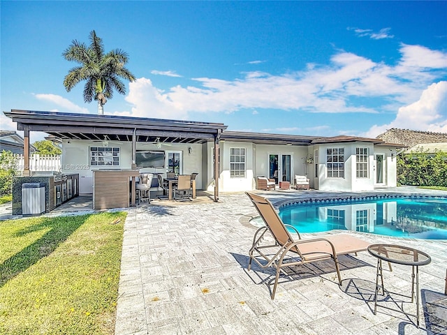 17931 NW 85th Ave, Hialeah, FL 33015 - back of property with area for grilling, stucco siding, and a patio