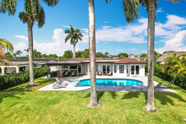 17931 NW 85th Ave, Hialeah, FL 33015 - rear view of house with french doors, a patio, an outdoor pool, and a yard
