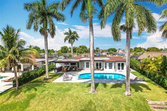 17931 NW 85th Ave, Hialeah, FL 33015 - swimming pool featuring a patio, french doors, and a yard