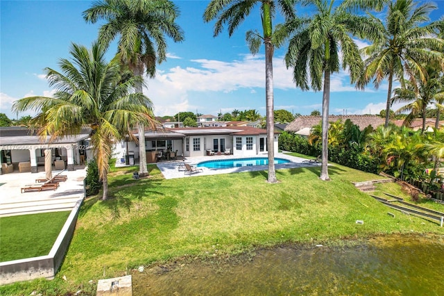 17931 NW 85th Ave, Hialeah, FL 33015 - back of property with a patio, an outdoor pool, and a lawn