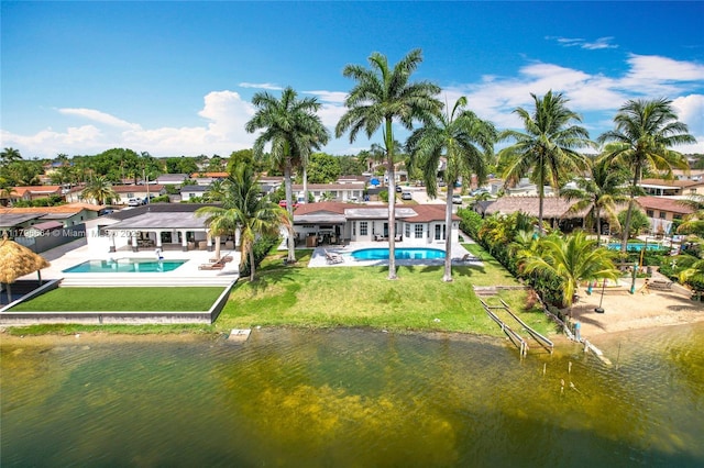 17931 NW 85th Ave, Hialeah, FL 33015 - back of property featuring an outdoor pool, a yard, a patio, a residential view, and a water view