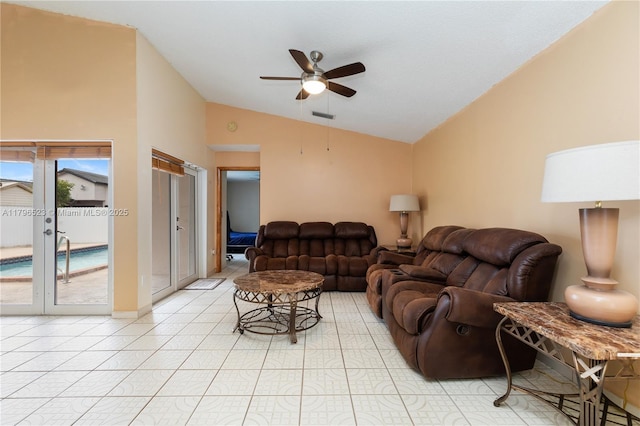 living area featuring french doors, light tile patterned flooring, visible vents, vaulted ceiling, and ceiling fan