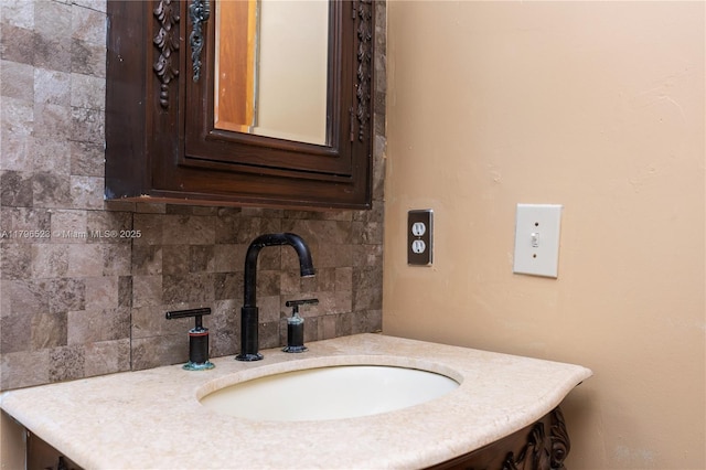 bathroom with vanity and backsplash