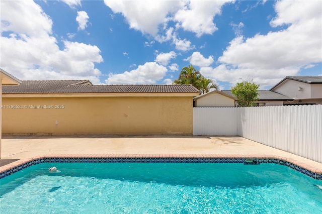 view of swimming pool with fence, a patio, and a fenced in pool