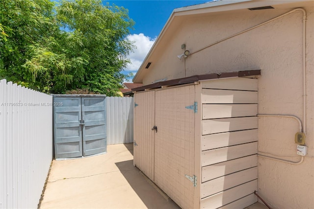 view of outdoor structure with fence