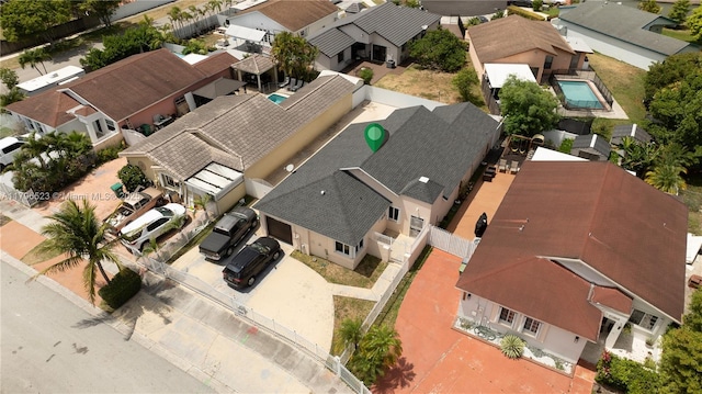 birds eye view of property with a residential view