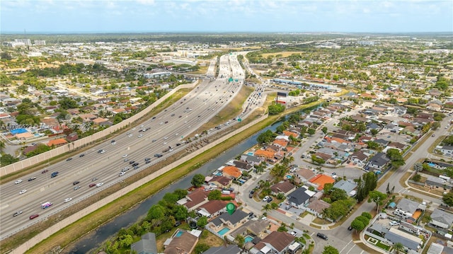 aerial view with a water view and a residential view