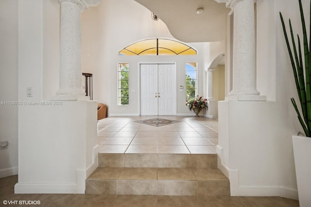 19058 SW 17th Ct, Miramar, FL 33029 - entryway featuring decorative columns, tile patterned floors, and baseboards