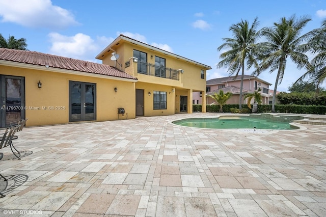 19058 SW 17th Ct, Miramar, FL 33029 - view of swimming pool featuring french doors, a patio area, and a pool with connected hot tub