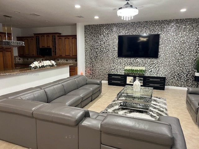 living room with light tile patterned floors, visible vents, and recessed lighting