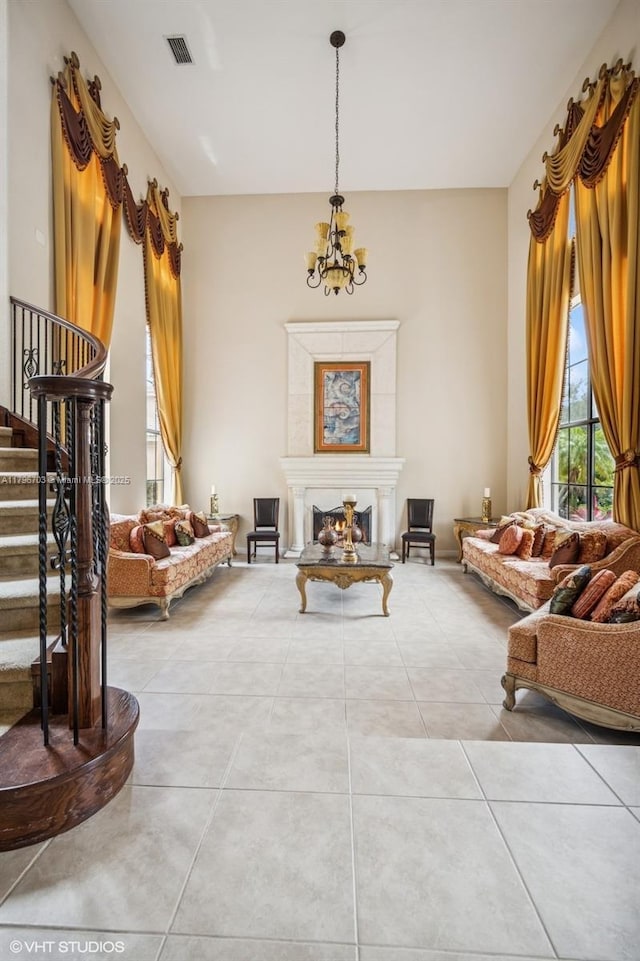 19058 SW 17th Ct, Miramar, FL 33029 - living area with a chandelier, stairway, light tile patterned floors, and a warm lit fireplace