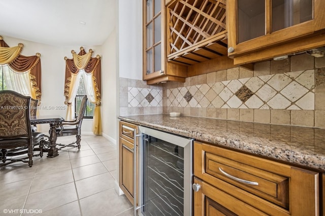 19058 SW 17th Ct, Miramar, FL 33029 - kitchen with beverage cooler, brown cabinets, tasteful backsplash, and light tile patterned flooring