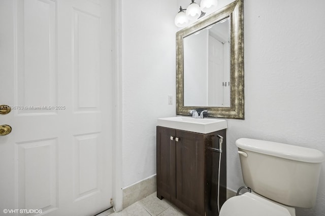 19058 SW 17th Ct, Miramar, FL 33029 - half bathroom featuring vanity, toilet, tile patterned flooring, and baseboards