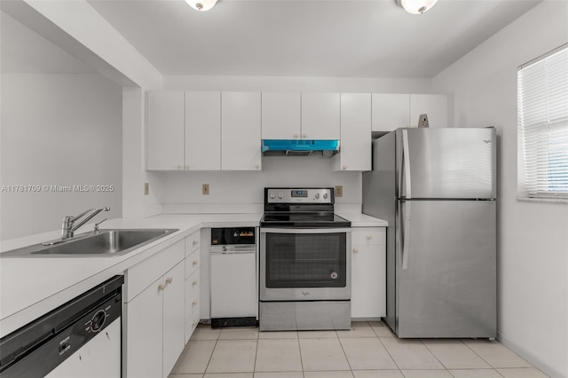 kitchen featuring under cabinet range hood, light countertops, stainless steel appliances, and a sink