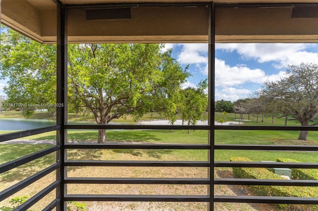 unfurnished sunroom with a water view