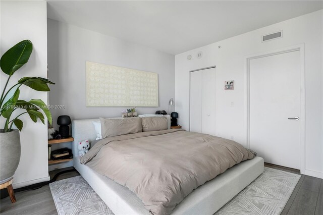 1300 S Miami Ave Unit 3405, Miami, FL 33130 - bedroom with a closet, visible vents, and wood finished floors