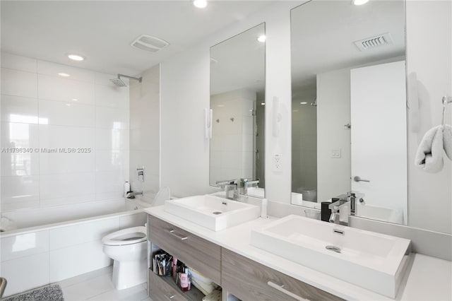 full bath featuring recessed lighting, toilet, visible vents, and a sink