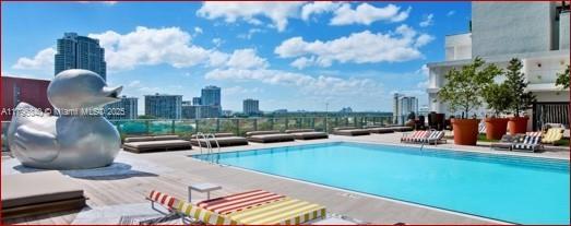 community pool featuring a view of city