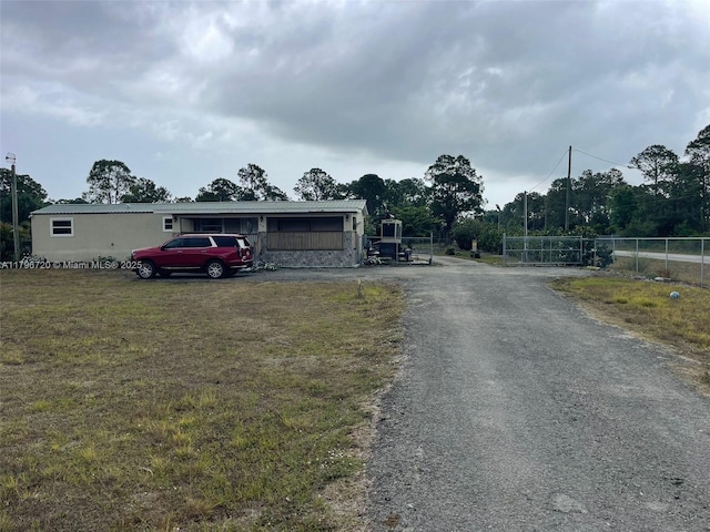 493 Camino Real Blvd, Clewiston, FL 33440 - view of street featuring aphalt driveway