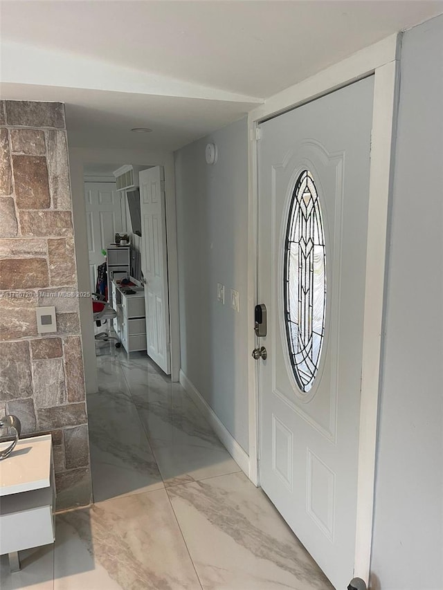 493 Camino Real Blvd, Clewiston, FL 33440 - foyer featuring baseboards and marble finish floor