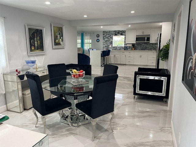 493 Camino Real Blvd, Clewiston, FL 33440 - dining space with marble finish floor, baseboards, and recessed lighting