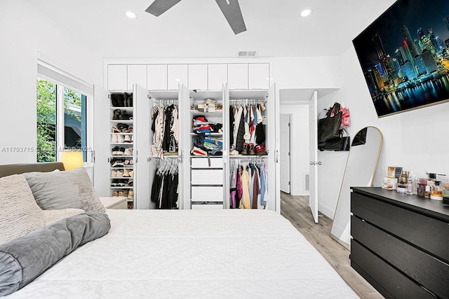 bedroom featuring a closet, light wood-type flooring, visible vents, recessed lighting, and a ceiling fan