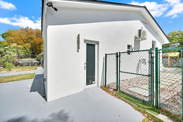 view of outdoor structure with a gate and fence