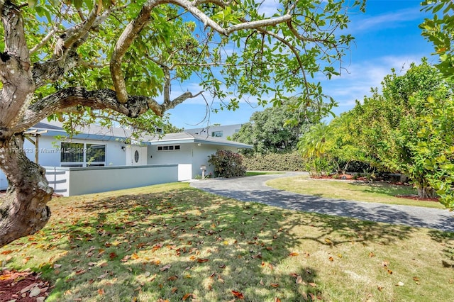 7600 SW 124th St, Pinecrest, FL 33156 - view of side of home with stucco siding and asphalt driveway