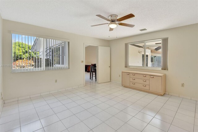 7600 SW 124th St, Pinecrest, FL 33156 - kitchen with white range with electric cooktop, healthy amount of natural light, a ceiling fan, lofted ceiling, and brown cabinetry