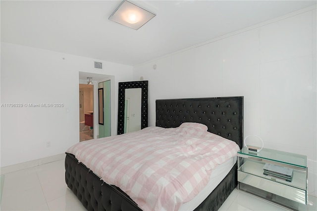 bedroom with light tile patterned floors, baseboards, and visible vents
