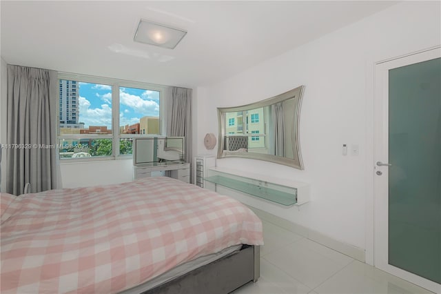 bedroom with light tile patterned floors