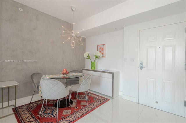 dining room with tile patterned floors, a chandelier, and baseboards