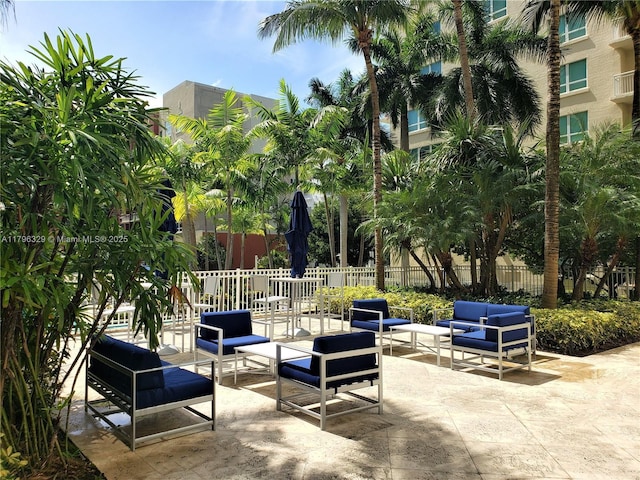 view of patio / terrace featuring fence and an outdoor living space