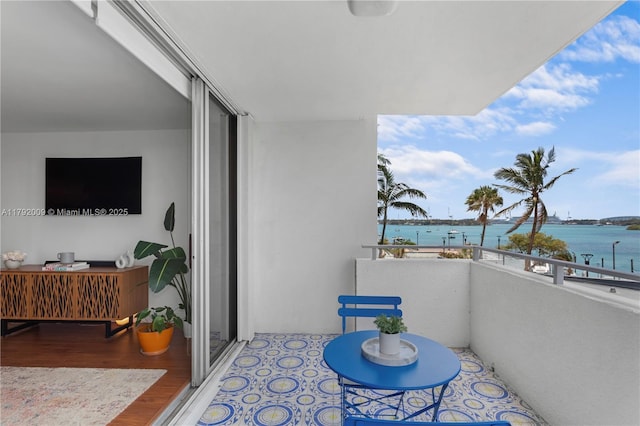 balcony featuring a water view