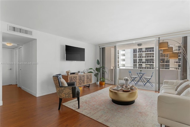 living area featuring wood finished floors and baseboards