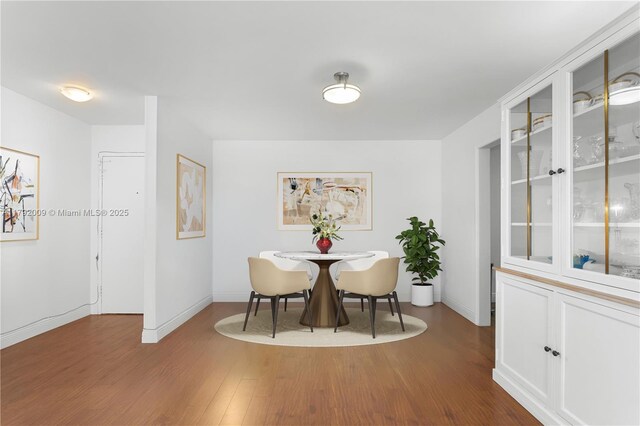 11 Island Ave Unit 407, Miami Beach, FL 33139 - dining space featuring wood finished floors and baseboards