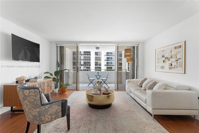 living room featuring wood finished floors and expansive windows