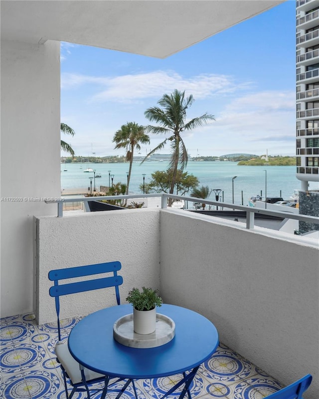 balcony featuring a water view