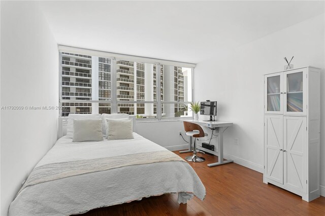 11 Island Ave Unit 407, Miami Beach, FL 33139 - bedroom with wood finished floors and baseboards