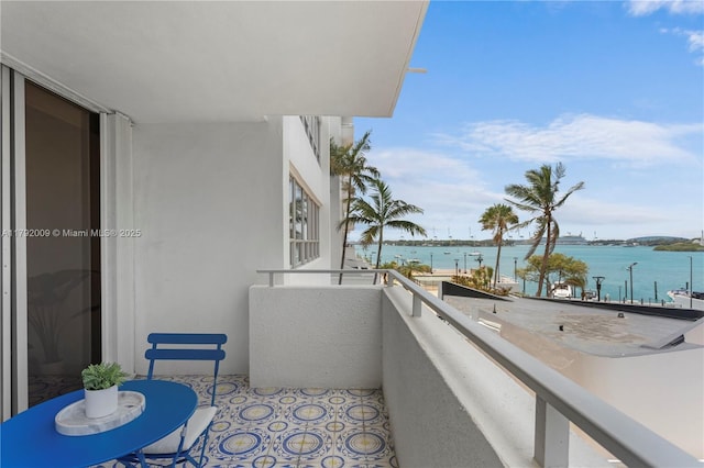 balcony featuring a water view