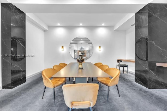 dining room featuring baseboards and recessed lighting