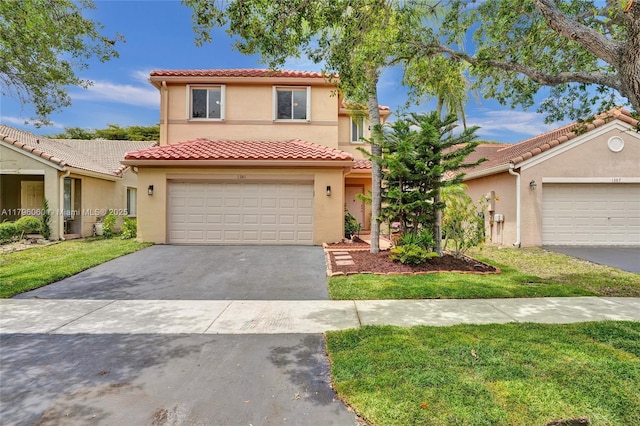 1381 Sago Ln, Weston, FL 33327 - mediterranean / spanish home with a front lawn, a tiled roof, stucco siding, and aphalt driveway