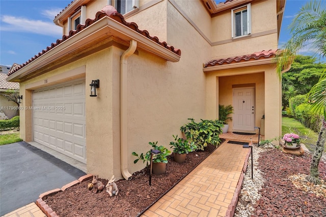 1381 Sago Ln, Weston, FL 33327 - doorway to property featuring stucco siding, a tiled roof, and driveway