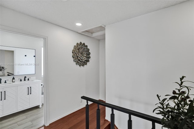 1381 Sago Ln, Weston, FL 33327 - corridor with recessed lighting, baseboards, a sink, wood finished floors, and an upstairs landing