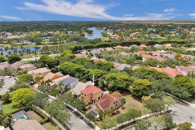 drone / aerial view with a water view and a residential view