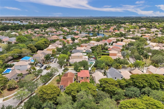 bird's eye view with a water view and a residential view