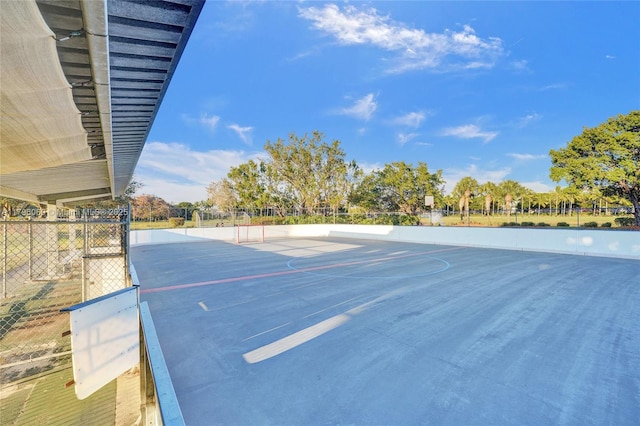 view of property's community featuring fence