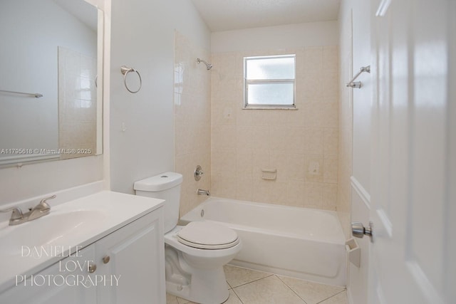 557 NW Fairfax Ave, Port St Lucie, FL 34983 - full bathroom with tile patterned floors, toilet, tub / shower combination, and vanity